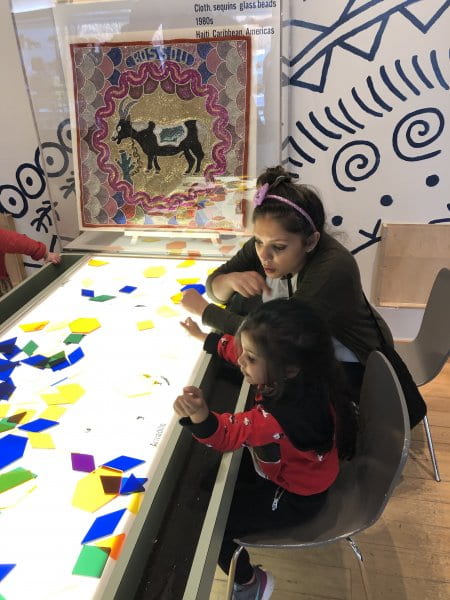 mommy and child using tangrams at the children's museum mommy and child using tangrams at the children's museum