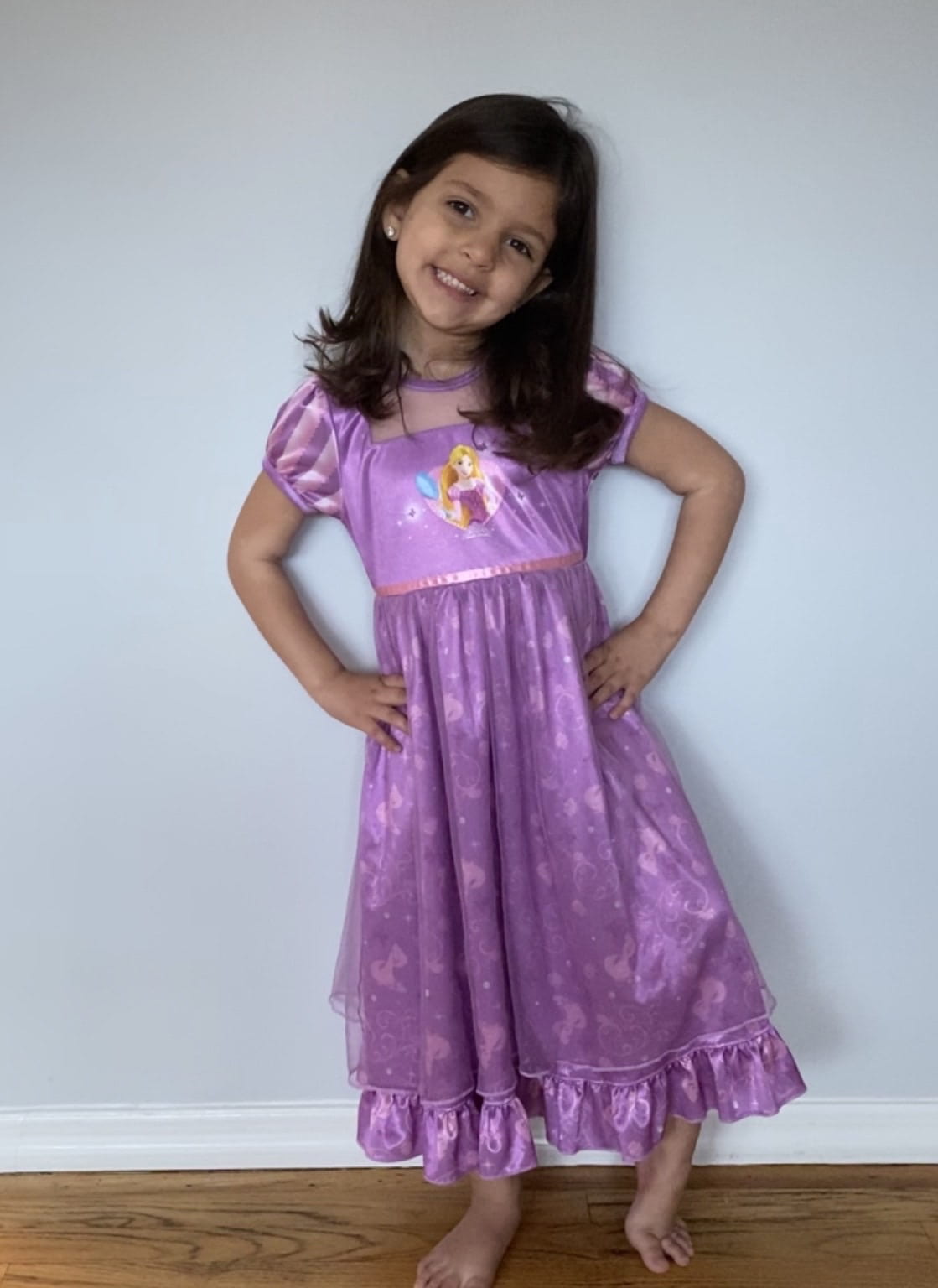 child wearing princess purple pajamas during remote learning