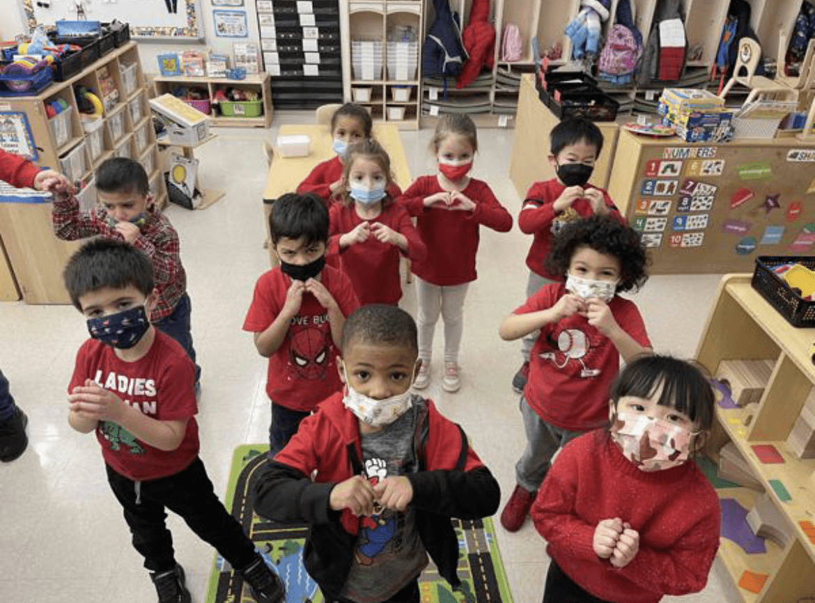 class making heart with their hands
